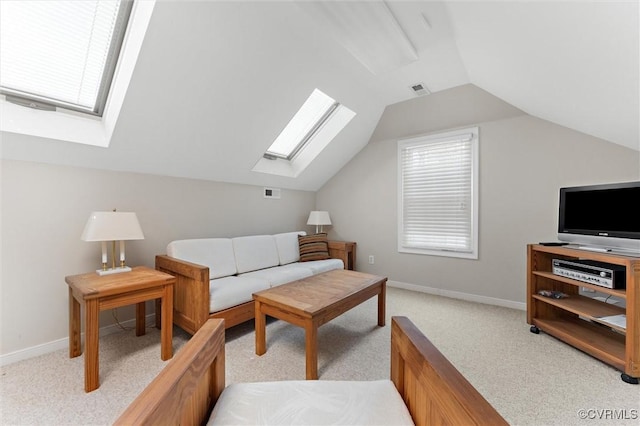 2730 Dalkeith Dr, Henrico, VA 23233 - living room featuring a skylight, light carpet, lofted ceiling, and baseboards