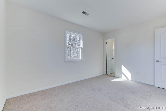 525 Helm Dr, Newport News, VA 23602 - spare room with light carpet and baseboards