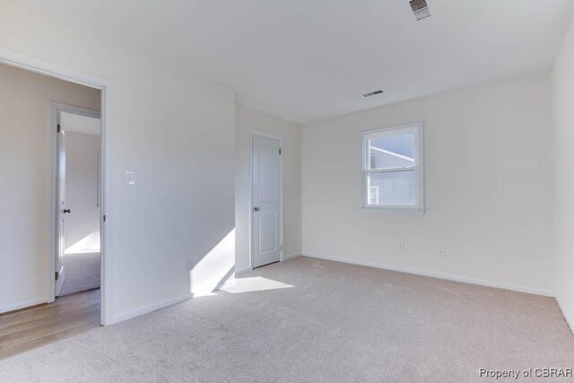 525 Helm Dr, Newport News, VA 23602 - carpeted empty room with baseboards