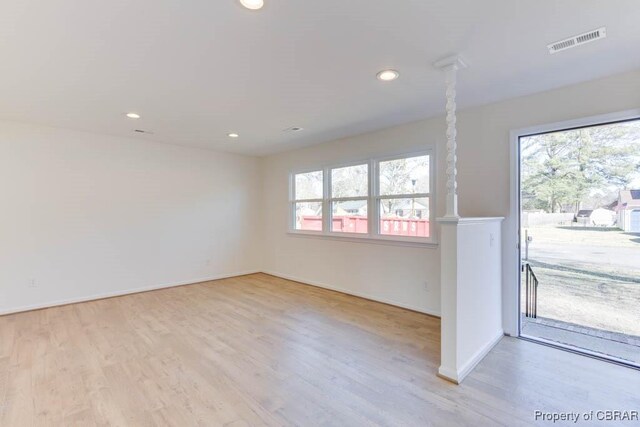 525 Helm Dr, Newport News, VA 23602 - empty room featuring plenty of natural light, wood finished floors, baseboards, and recessed lighting
