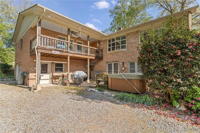 2133 Bloomsherry Dr, Chesterfield, VA 23235 - rear view of house with a hot tub, a balcony, brick siding, an attached garage, and a patio area