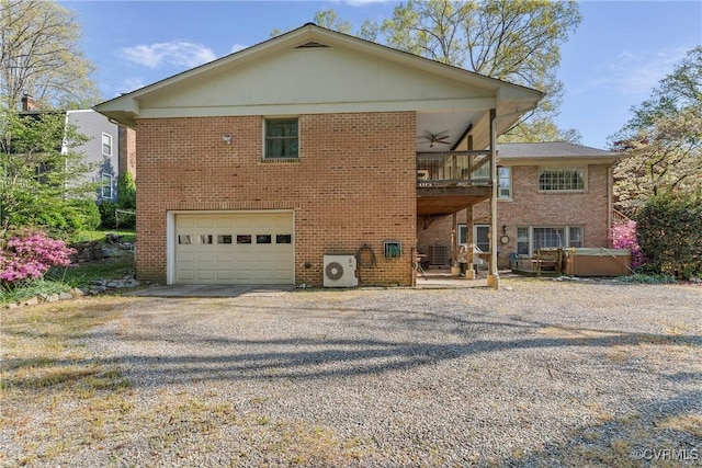 2133 Bloomsherry Dr, Chesterfield, VA 23235 - back of property with a hot tub, gravel driveway, a ceiling fan, and brick siding