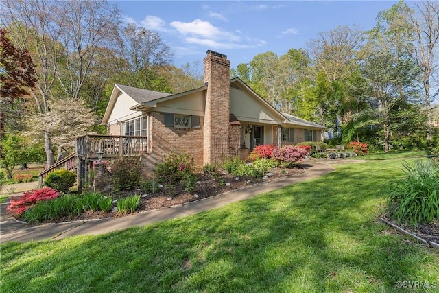 2133 Bloomsherry Dr, Chesterfield, VA 23235 - view of side of property featuring a chimney, a lawn, brick siding, and a wooden deck