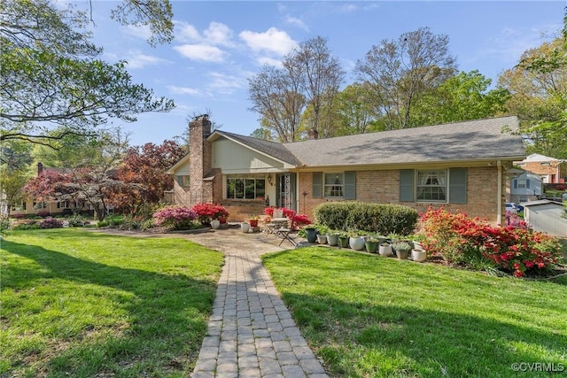 2133 Bloomsherry Dr, Chesterfield, VA 23235 - view of front of property featuring a chimney, a front lawn, and brick siding