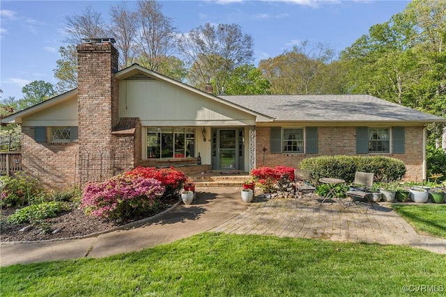 2133 Bloomsherry Dr, Chesterfield, VA 23235 - back of property featuring a chimney and brick siding