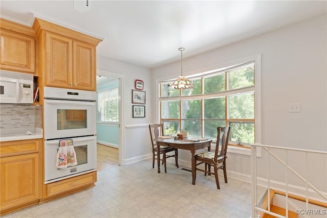 2133 Bloomsherry Dr, Chesterfield, VA 23235 - kitchen featuring white appliances, decorative backsplash, light countertops, light flooring, and pendant lighting