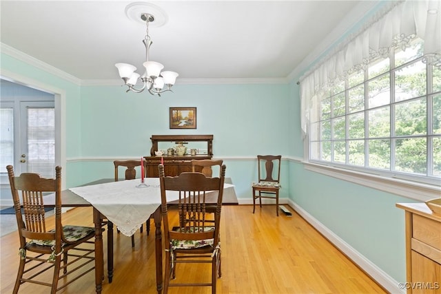 2133 Bloomsherry Dr, Chesterfield, VA 23235 - dining area featuring a chandelier, light wood-type flooring, baseboards, and crown molding