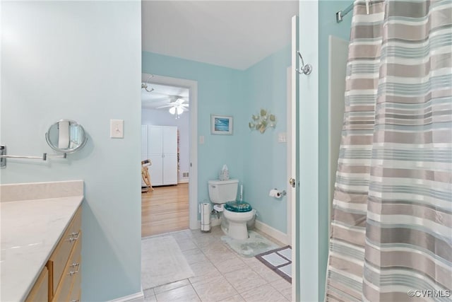 2133 Bloomsherry Dr, Chesterfield, VA 23235 - bathroom with vanity, toilet, ceiling fan, baseboards, and tile patterned floors