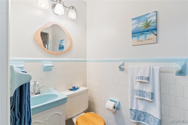 2133 Bloomsherry Dr, Chesterfield, VA 23235 - half bathroom featuring tile walls, a wainscoted wall, vanity, and toilet