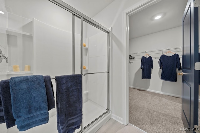 111 Leonard Ct, King William, VA 23009 - full bathroom with a shower stall, a walk in closet, and baseboards
