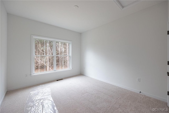 15124 Johns Trace Cir, Montpelier, VA 23192 - spare room featuring carpet floors, baseboards, and attic access