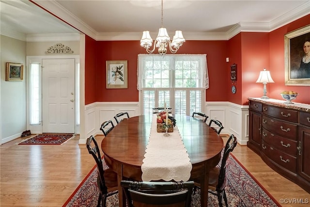 423 Elm Creek Dr, Manakin Sabot, VA 23103 - dining area featuring a chandelier, light wood-style floors, wainscoting, ornamental molding, and a decorative wall