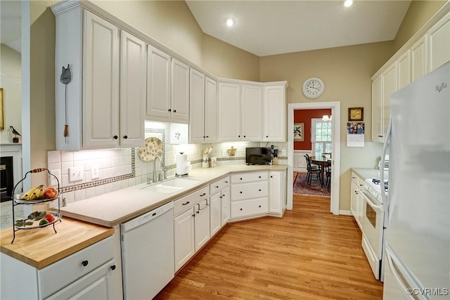 423 Elm Creek Dr, Manakin Sabot, VA 23103 - kitchen featuring white appliances, a sink, light wood-style floors, decorative backsplash, and white cabinetry