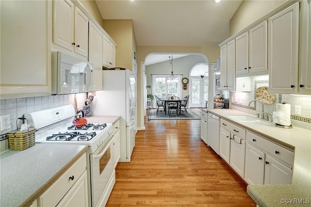 423 Elm Creek Dr, Manakin Sabot, VA 23103 - kitchen with white appliances, ornate columns, a sink, arched walkways, and lofted ceiling