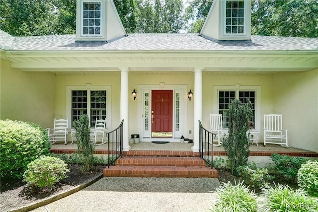 423 Elm Creek Dr, Manakin Sabot, VA 23103 - entrance to property with roof with shingles, a porch, and stucco siding