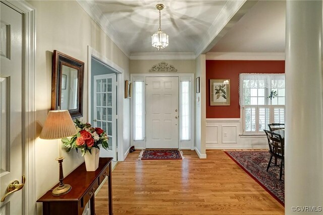 423 Elm Creek Dr, Manakin Sabot, VA 23103 - foyer with light wood-style flooring and ornamental molding