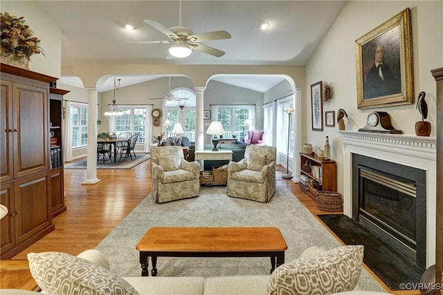 423 Elm Creek Dr, Manakin Sabot, VA 23103 - living area featuring ornate columns, arched walkways, a ceiling fan, light wood-style flooring, and vaulted ceiling