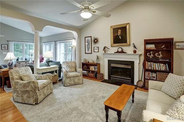 423 Elm Creek Dr, Manakin Sabot, VA 23103 - living room with lofted ceiling, decorative columns, wood finished floors, ceiling fan, and a fireplace with flush hearth