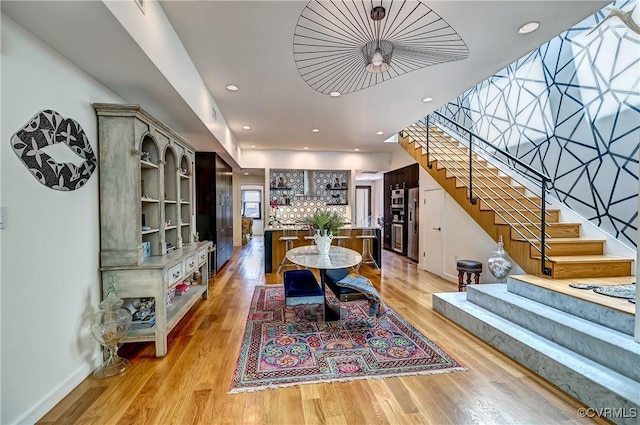 26171/2 Floyd Ave, Richmond, VA 23220 - dining room featuring stairs, light wood-style flooring, and recessed lighting