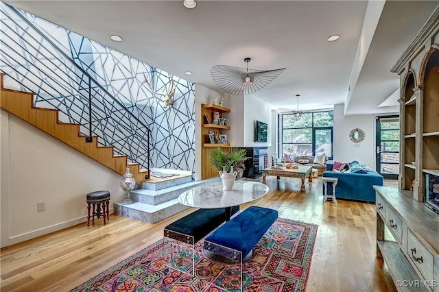 26171/2 Floyd Ave, Richmond, VA 23220 - living area featuring wood finished floors, stairs, and recessed lighting