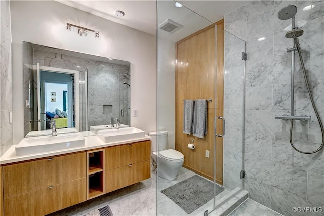 26171/2 Floyd Ave, Richmond, VA 23220 - bathroom with a stall shower and double vanity