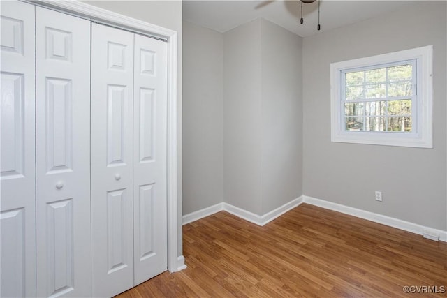 11512 Duncan Rd, Dinwiddie, VA 23805 - unfurnished bedroom featuring baseboards, a closet, and light wood-type flooring