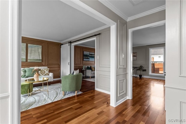 1716 First Colonial Ct, Richmond, VA 23231 - living area with a decorative wall, wood finished floors, crown molding, and a barn door