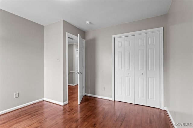 1716 First Colonial Ct, Richmond, VA 23231 - unfurnished bedroom featuring wood finished floors, baseboards, and a closet