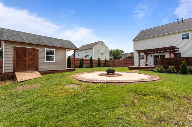 1716 First Colonial Ct, Richmond, VA 23231 - view of yard with an outdoor fire pit, a pergola, a wooden deck, and an outdoor structure