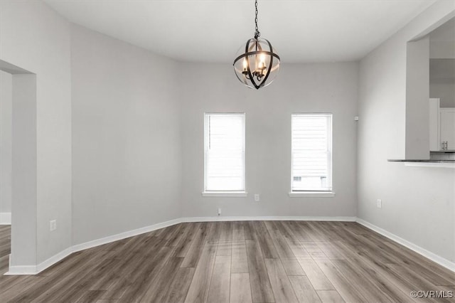 1317 N 22nd St, Richmond, VA 23223 - unfurnished room featuring wood finished floors and a chandelier