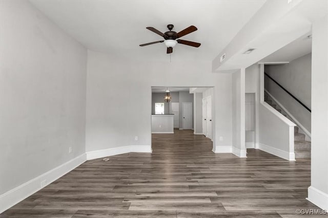 1317 N 22nd St, Richmond, VA 23223 - unfurnished living room featuring a ceiling fan, wood finished floors, and stairs
