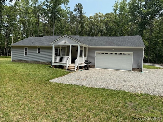 1205 Trimmers Shop Rd, West Point, VA 23181 - ranch-style home featuring covered porch, gravel driveway, a garage, a front yard, and a shingled roof