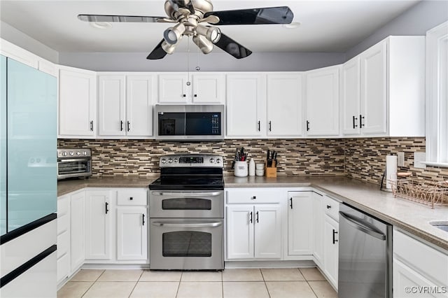 119 Monath Rd, Richmond, VA 23236 - kitchen with appliances with stainless steel finishes, ceiling fan, light tile patterned floors, and white cabinets