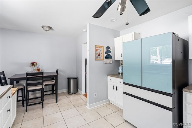 119 Monath Rd, Richmond, VA 23236 - kitchen featuring freestanding refrigerator, a ceiling fan, light tile patterned flooring, and white cabinets