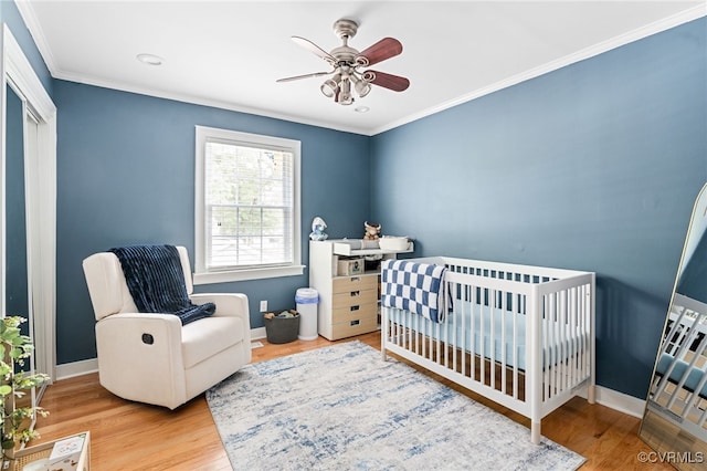 119 Monath Rd, Richmond, VA 23236 - bedroom with ornamental molding, wood finished floors, a nursery area, and ceiling fan