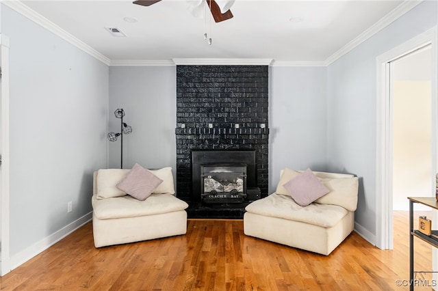 119 Monath Rd, Richmond, VA 23236 - living area with ornamental molding, a ceiling fan, wood finished floors, and a fireplace