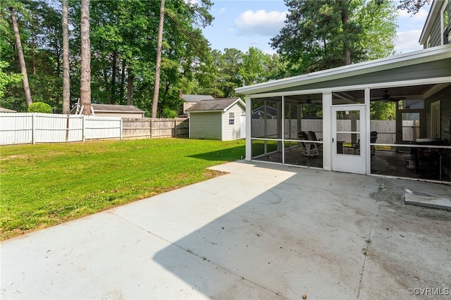 119 Monath Rd, Richmond, VA 23236 - fenced backyard featuring a sunroom, a patio area, a ceiling fan, and a storage shed