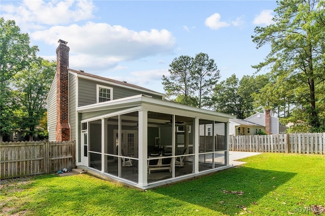 119 Monath Rd, Richmond, VA 23236 - rear view of house featuring a sunroom, a chimney, a fenced backyard, and a ceiling fan