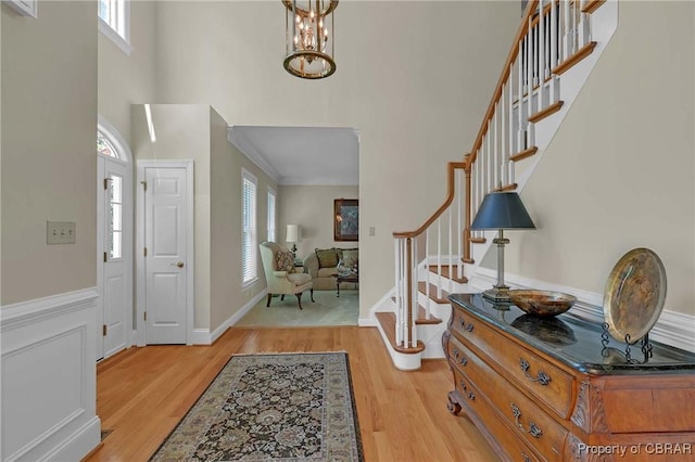 1708 Centennial Dr, Toano, VA 23168 - entryway featuring light wood-style floors, stairs, and a high ceiling