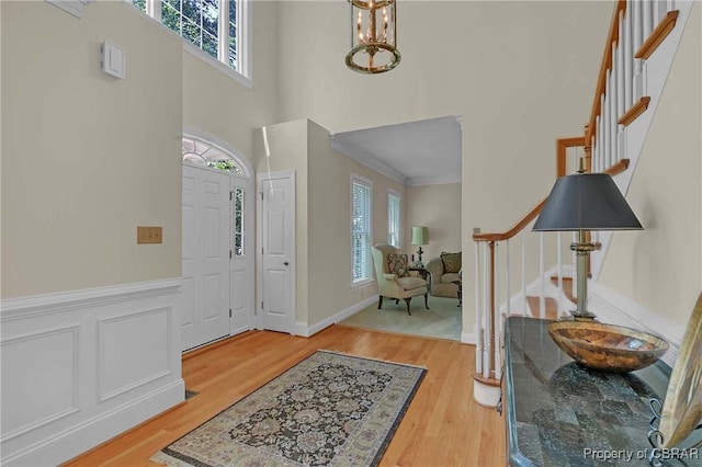 1708 Centennial Dr, Toano, VA 23168 - entryway with stairway, healthy amount of natural light, light wood-style floors, a towering ceiling, and ornamental molding