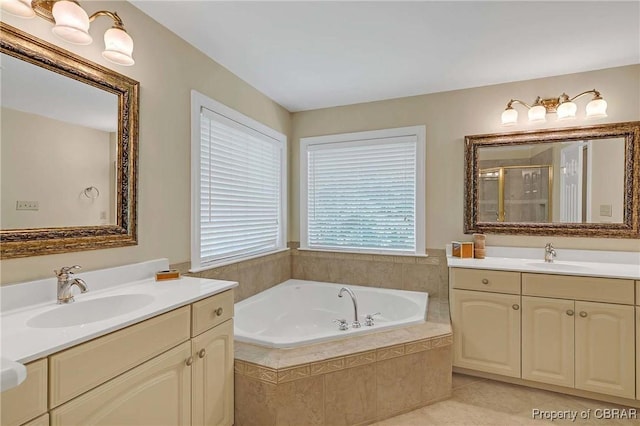 1708 Centennial Dr, Toano, VA 23168 - full bath with two vanities, a bath, a stall shower, and tile patterned flooring