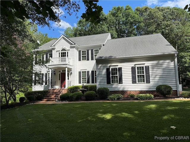 1708 Centennial Dr, Toano, VA 23168 - view of front of home featuring a balcony, a front lawn, and a shingled roof