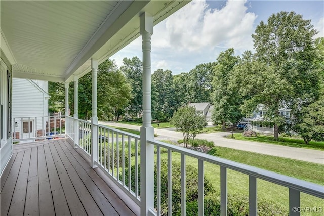 1537 Winbury Dr, Midlothian, VA 23114 - wooden porch featuring a lawn and view of wooded area