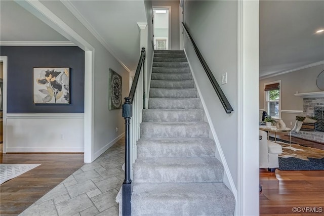 1537 Winbury Dr, Midlothian, VA 23114 - staircase with crown molding, stone tile flooring, and a fireplace