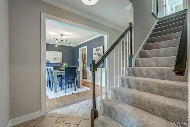 1537 Winbury Dr, Midlothian, VA 23114 - staircase featuring ornamental molding, stone tile floors, and a chandelier