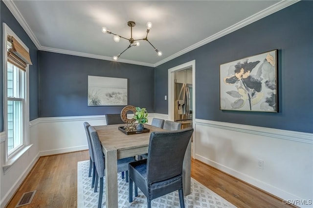 1537 Winbury Dr, Midlothian, VA 23114 - dining room featuring a chandelier, wood finished floors, and crown molding