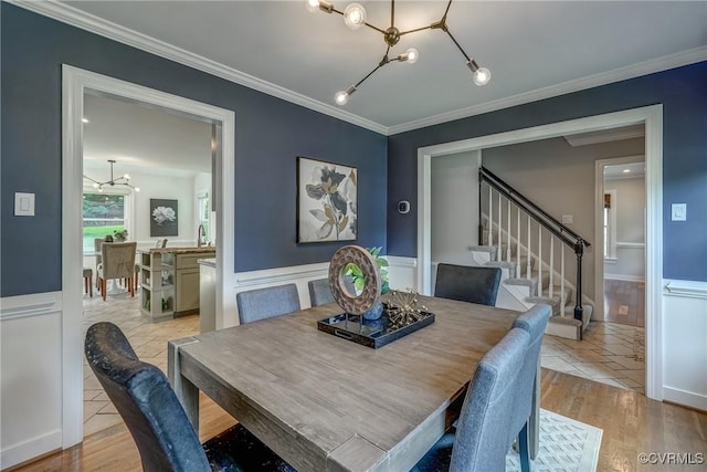 1537 Winbury Dr, Midlothian, VA 23114 - dining area with a chandelier, stairway, a wainscoted wall, crown molding, and light tile patterned flooring