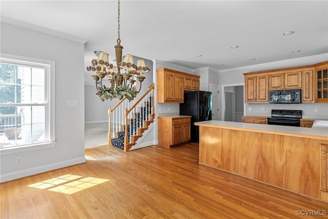12055 Hadden Hall Dr, Chesterfield, VA 23838 - kitchen with black appliances, light countertops, crown molding, light wood-style floors, and a chandelier