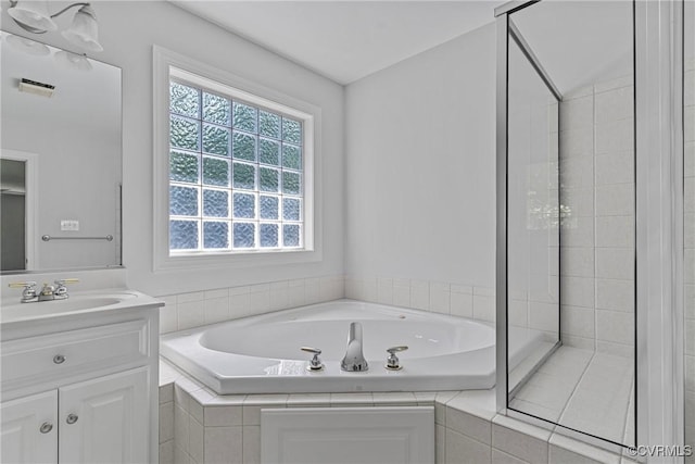 12055 Hadden Hall Dr, Chesterfield, VA 23838 - full bathroom with vanity, a bath, and a shower stall