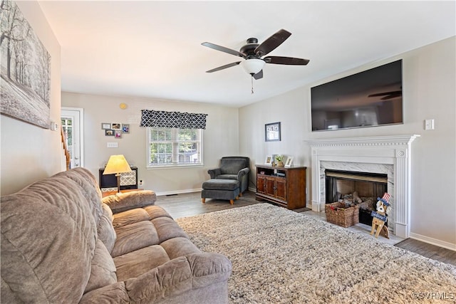 12819 Millstep Ter, Midlothian, VA 23112 - living area with wood finished floors, a ceiling fan, and a premium fireplace